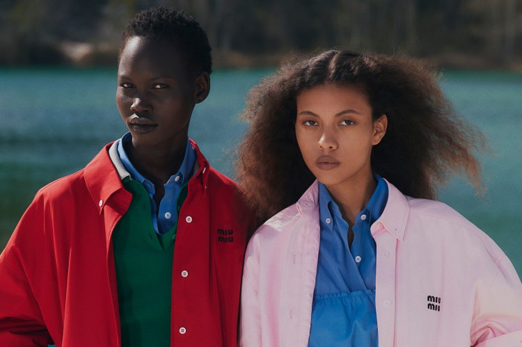 Two models wearing Miu Miu clothing on a beach.